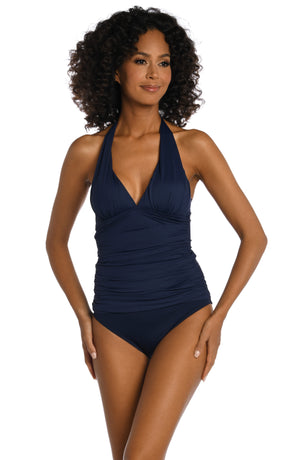 
            
                Load image into Gallery viewer, Model is wearing a indigo colored halter tankini swimsuit top from our Best-Selling Island Goddess collection.
            
        