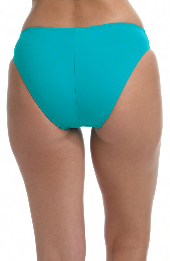 Model is wearing a turquoise colored hipster swimsuit bottom from our Best-Selling Island Goddess collection.