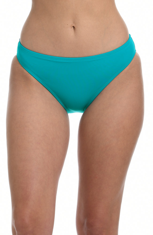 Model is wearing a turquoise colored hipster swimsuit bottom from our Best-Selling Island Goddess collection.