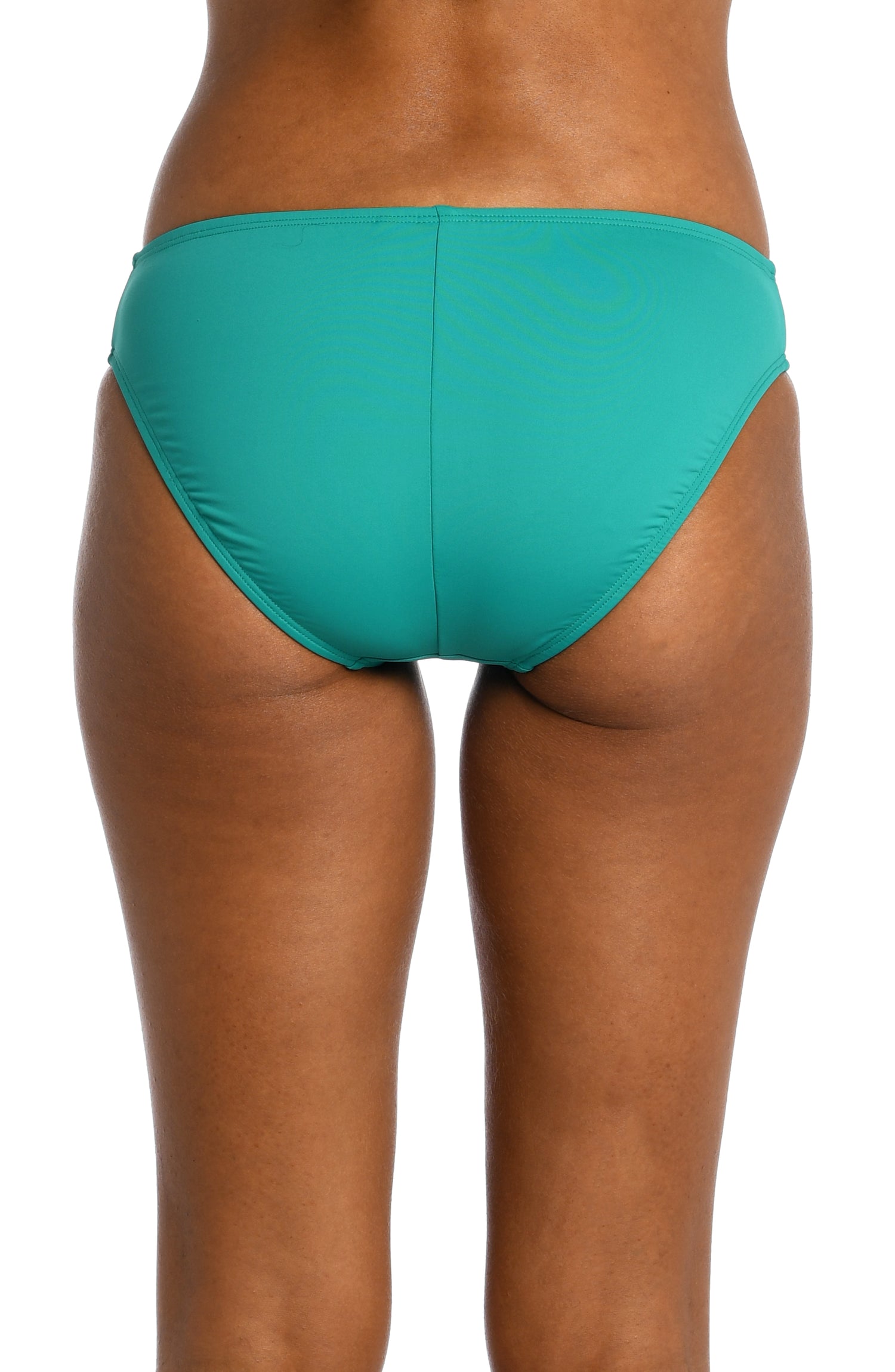 Model is wearing a emerald colored hipster swimsuit bottom from our Best-Selling Island Goddess collection.