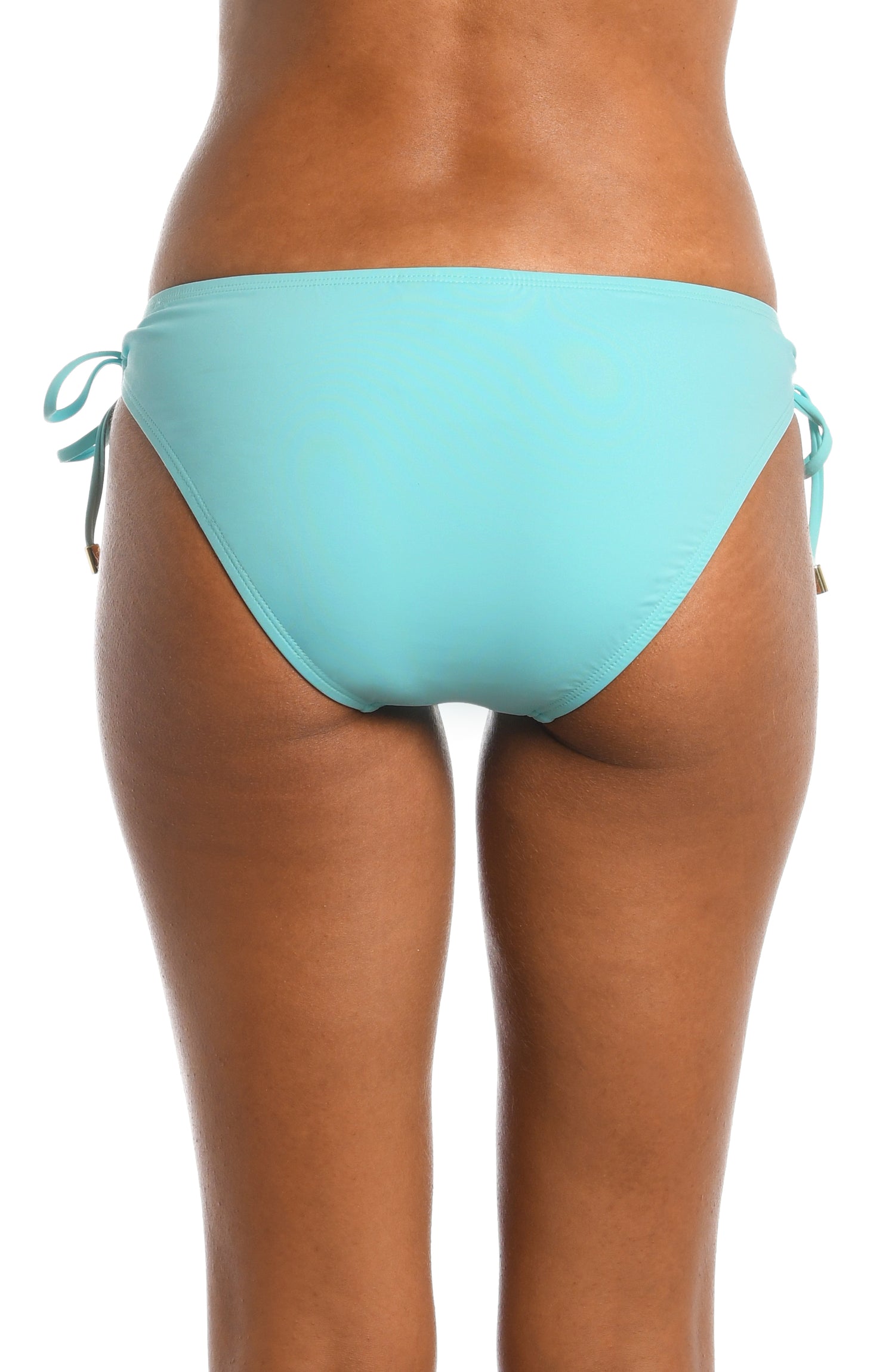 Model is wearing a ice blue colored side-tie swimsuit bottom from our Best-Selling Island Goddess collection.
