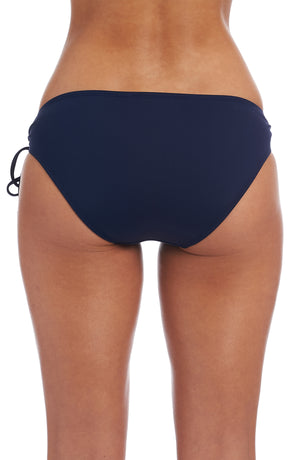 
            
                Load image into Gallery viewer, Model is wearing a indigo colored side-tie hipster swimsuit bottom from our Best-Selling Island Goddess collection.
            
        