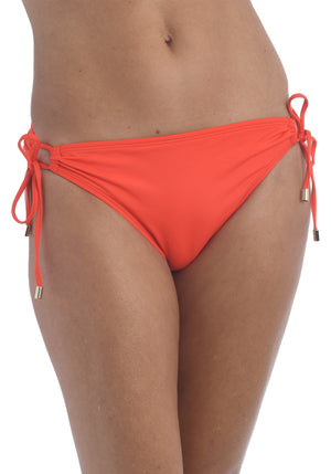 Model is wearing a paprika colored side-tie swimsuit bottom from our Best-Selling Island Goddess collection.