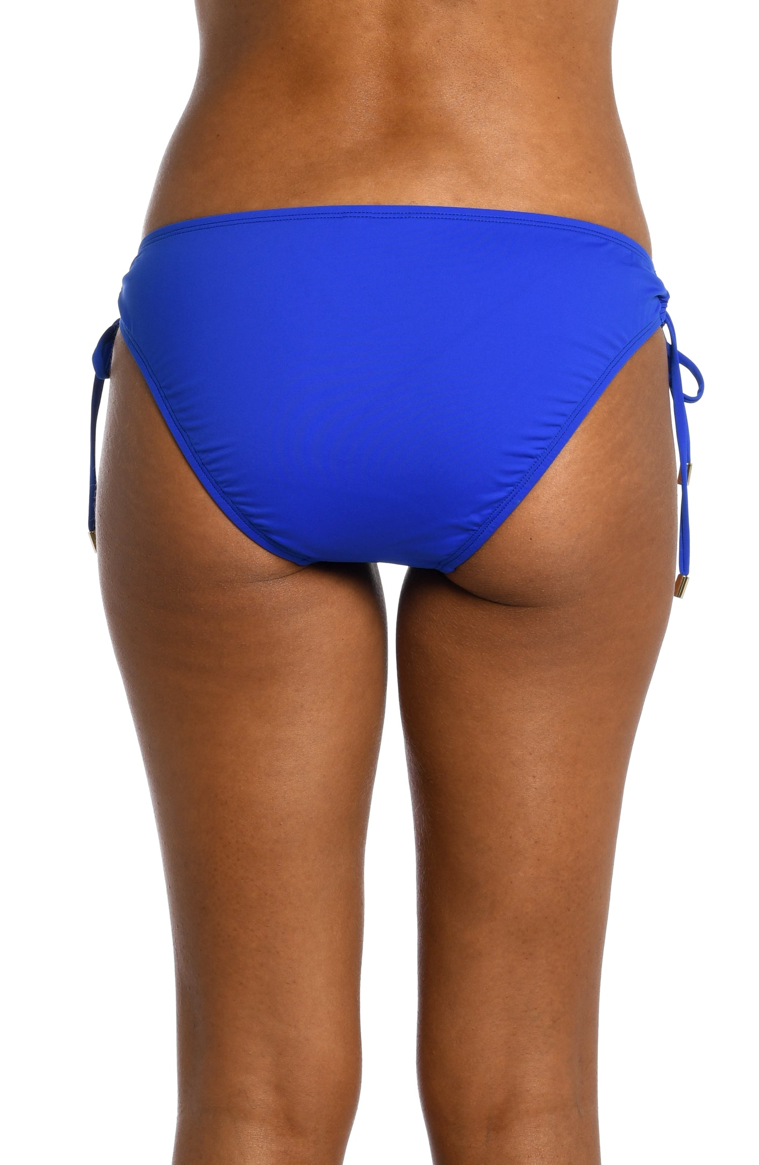 Model is wearing a sapphire colored side-tie hipster swimsuit bottom from our Best-Selling Island Goddess collection.