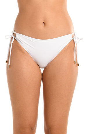 Model is wearing a white side-tie hipster swimsuit bottom from our Best-Selling Island Goddess collection.