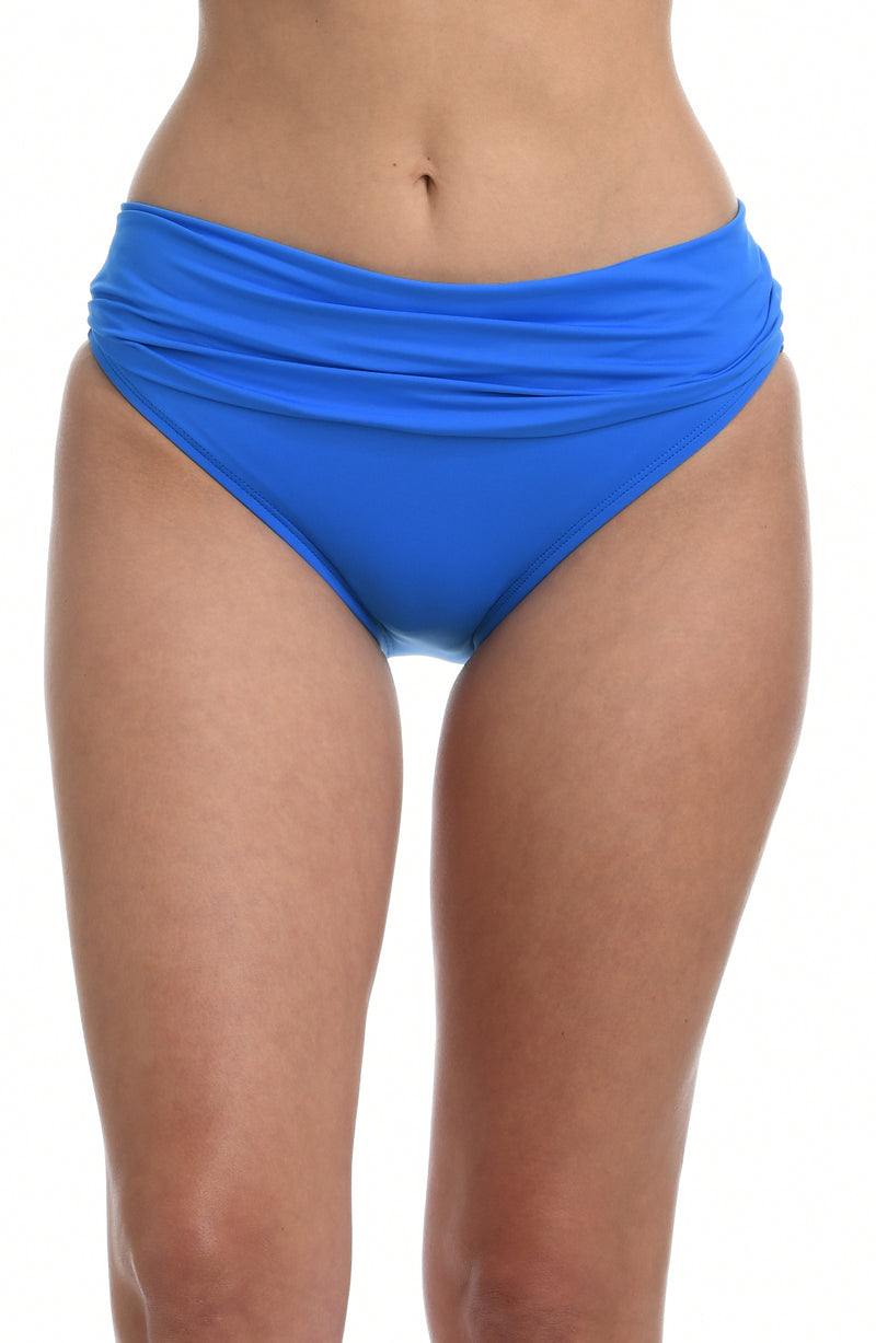 Model is wearing a capri blue colored shirred hipster swimsuit bottom from our Best-Selling Island Goddess collection.