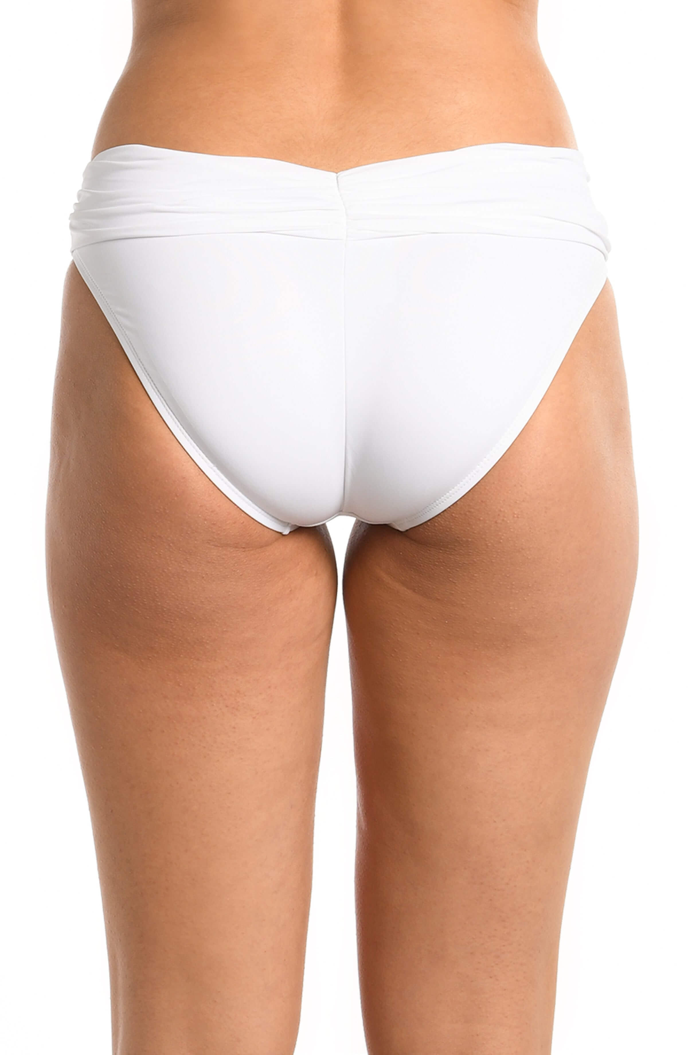 Model is wearing a white shirred hipster swimsuit bottom from our Best-Selling Island Goddess collection.
