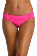 Model is wearing a pop pink colored side-shirred swimsuit bottom from our Best-Selling Island Goddess collection.