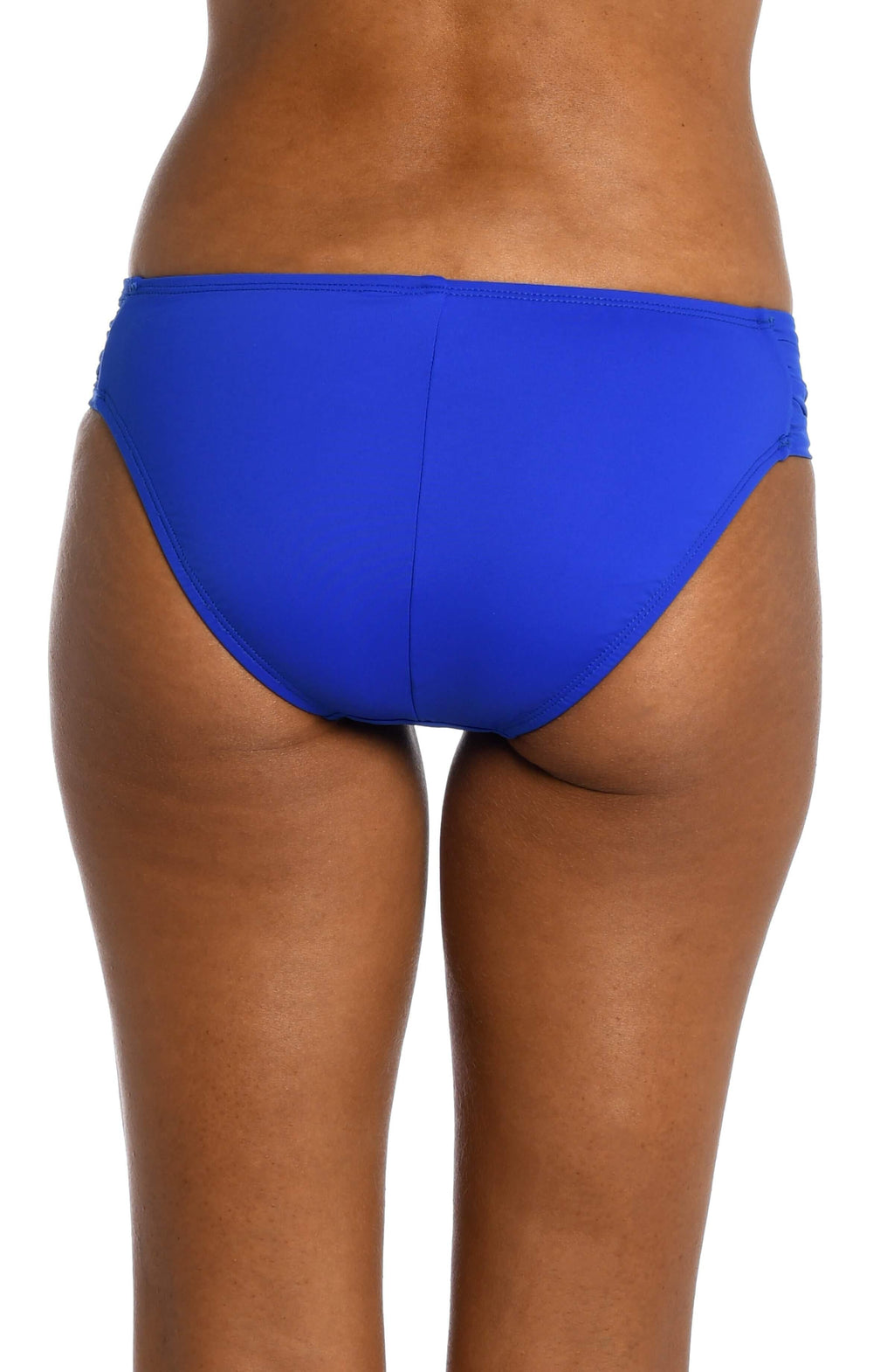 Model is wearing a sapphire colored side shirred swimsuit bottom from our Best-Selling Island Goddess collection.
