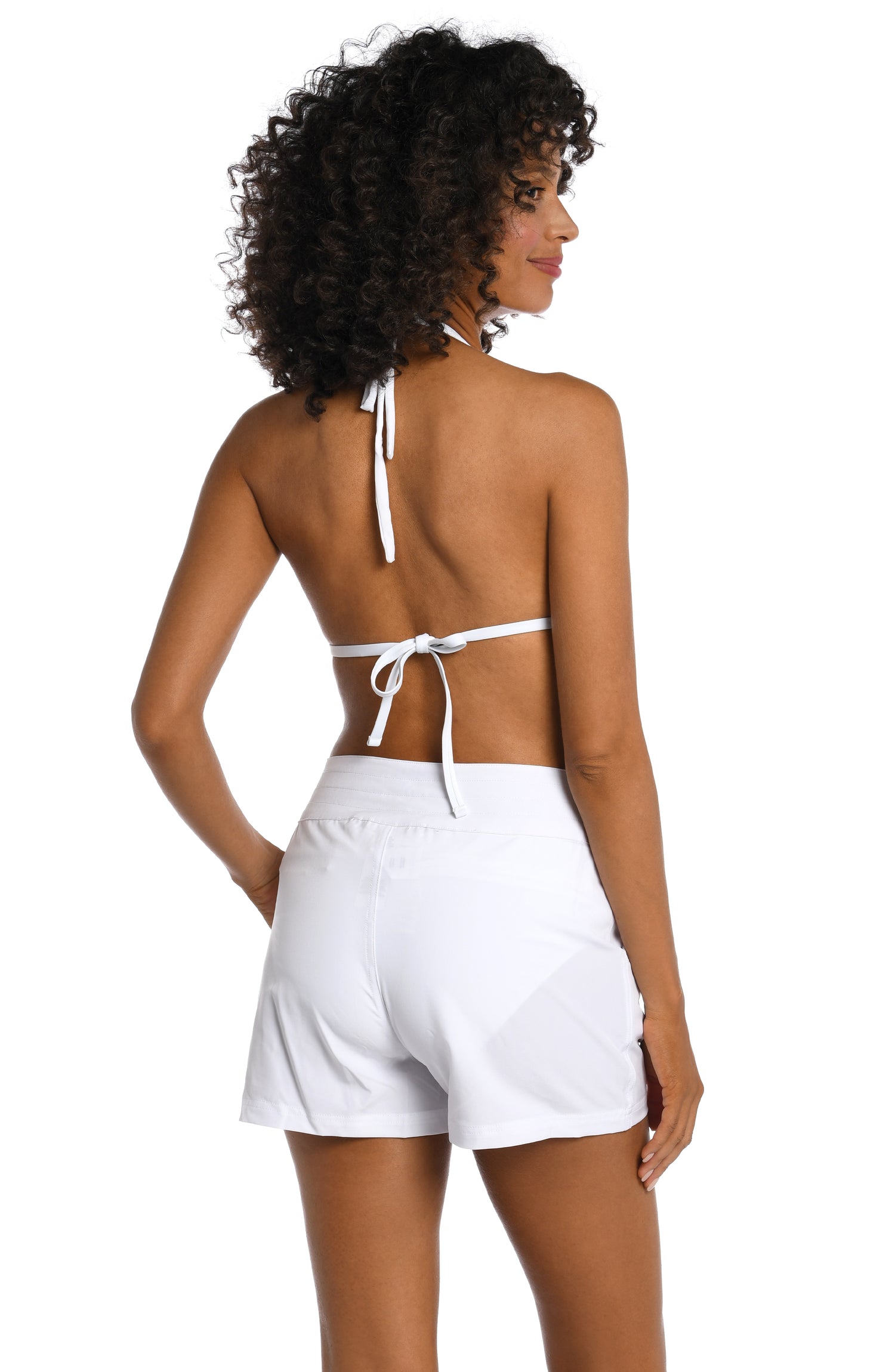 Model is wearing a white colored board short swimsuit from our All Aboard collection.