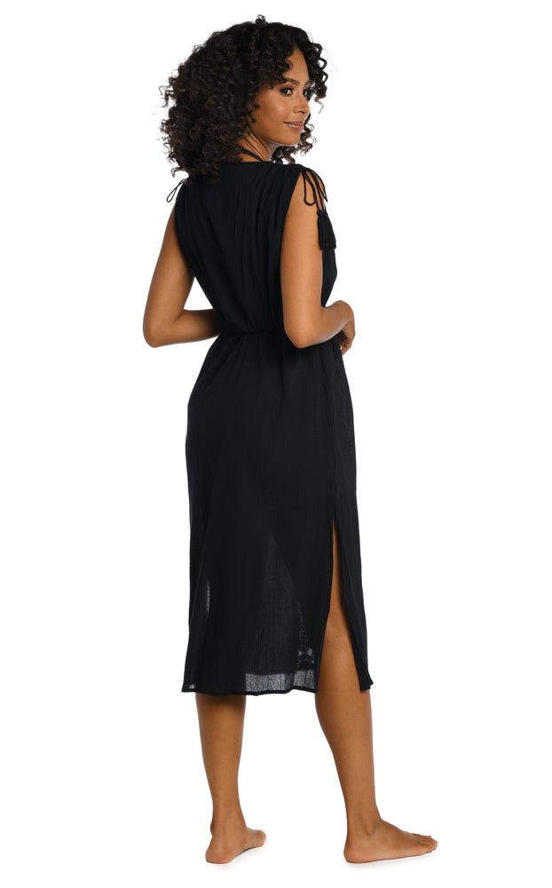 
            
                Load image into Gallery viewer, Model is wearing a black mid-length dress swimsuit cover up from our Island Fare collection.
            
        