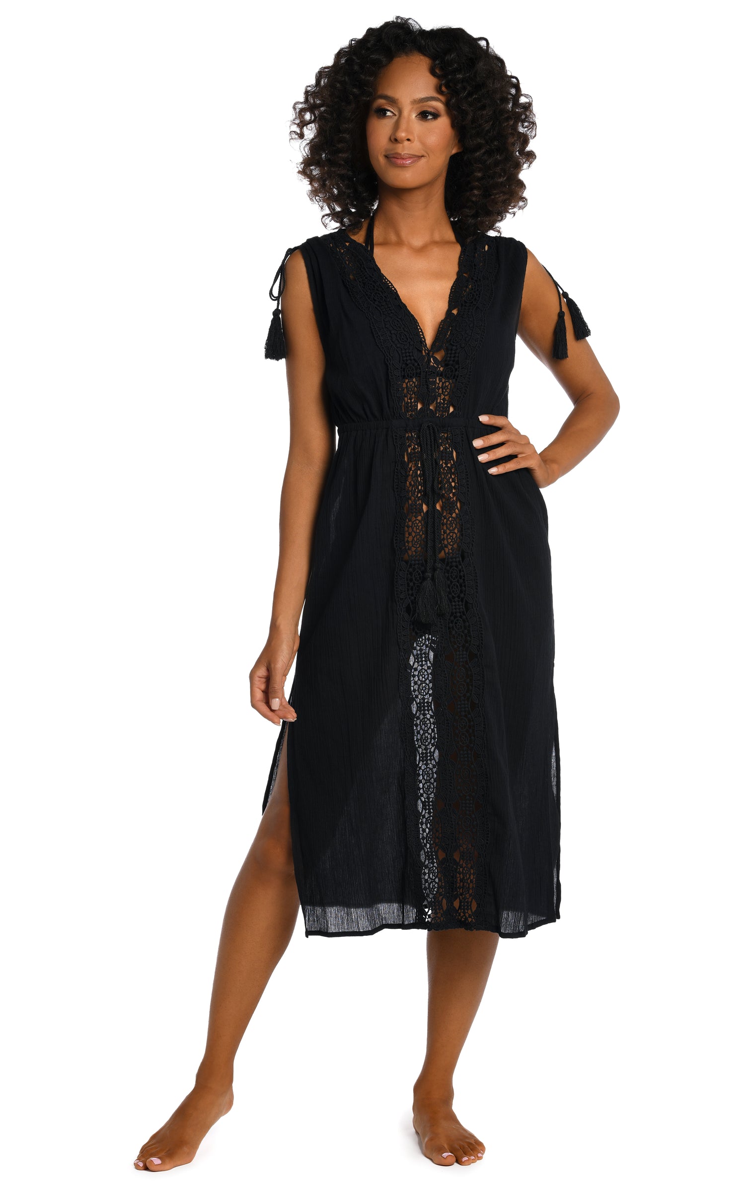 Model is wearing a black mid-length dress swimsuit cover up from our Island Fare collection.