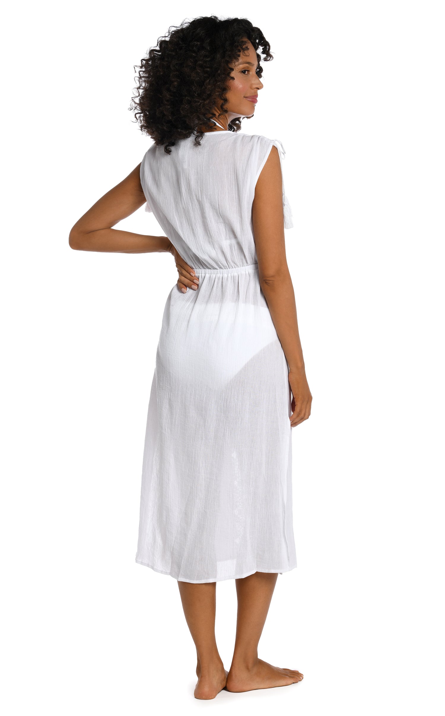 Model is wearing a white mid-length dress swimsuit cover up from our Island Fare collection.