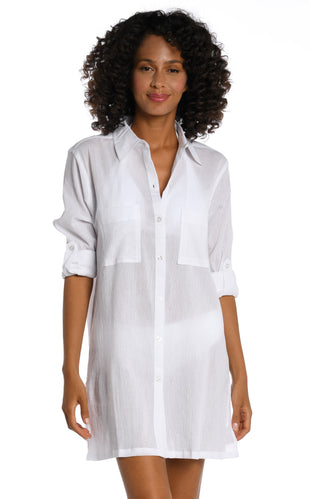 Model is wearing a white button shirt swimsuit cover up from our Island Fare collection.