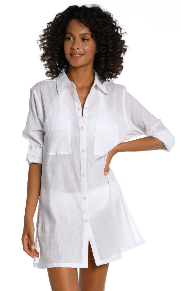Model is wearing a white button shirt swimsuit cover up from our Island Fare collection.