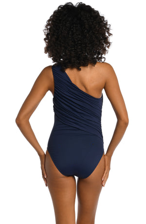 Model is wearing a indigo colored one piece swimsuit from our Best-Selling Island Goddess collection.