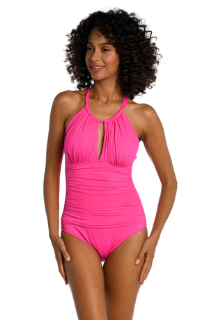 Model is wearing a pop pink colored one piece swimsuit from our Best-Selling Island Goddess collection.