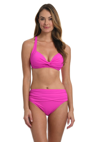 Model is wearing a orchid colored twist front swimsuit top from our Best-Selling Island Goddess collection.