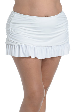 
            
                Load image into Gallery viewer, Model is wearing a white ruffle skirted swimsuit bottom from our Best-Selling Island Goddess collection.
            
        