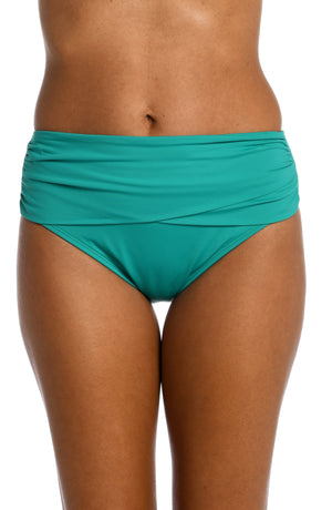 
            
                Load image into Gallery viewer, Model is wearing a emerald colored mid-waist swimsuit bottom from our Best-Selling Island Goddess collection.
            
        