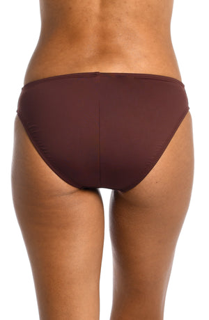 Model is wearing a java colored mid-waist swimsuit bottom from our Best-Selling Island Goddess collection.