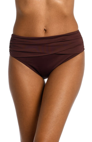 Model is wearing a java colored mid-waist swimsuit bottom from our Best-Selling Island Goddess collection.