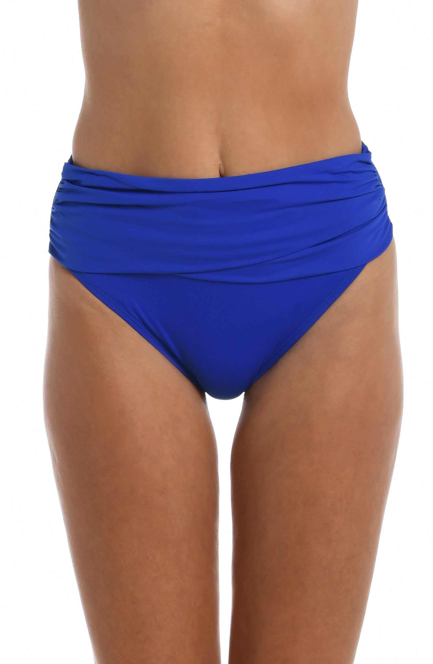 Model is wearing a sapphire colored mid-waist swimsuit bottom from our Best-Selling Island Goddess collection.