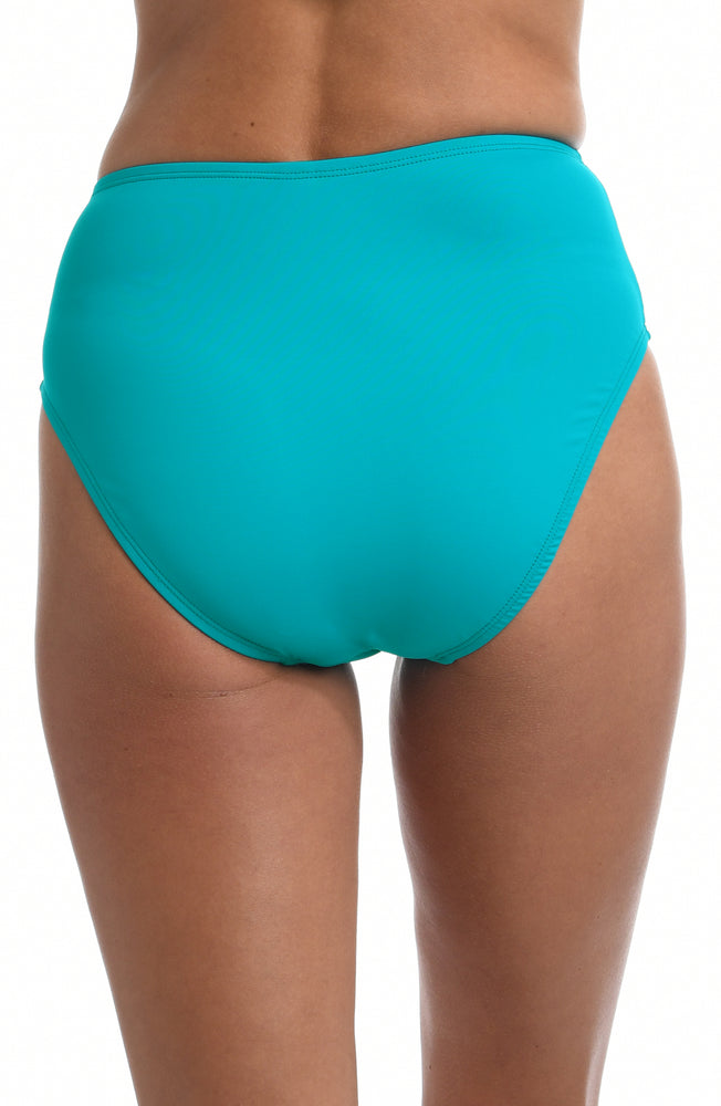 Model is wearing a turquoise colored high waist swimsuit bottom from our Best-Selling Island Goddess collection.