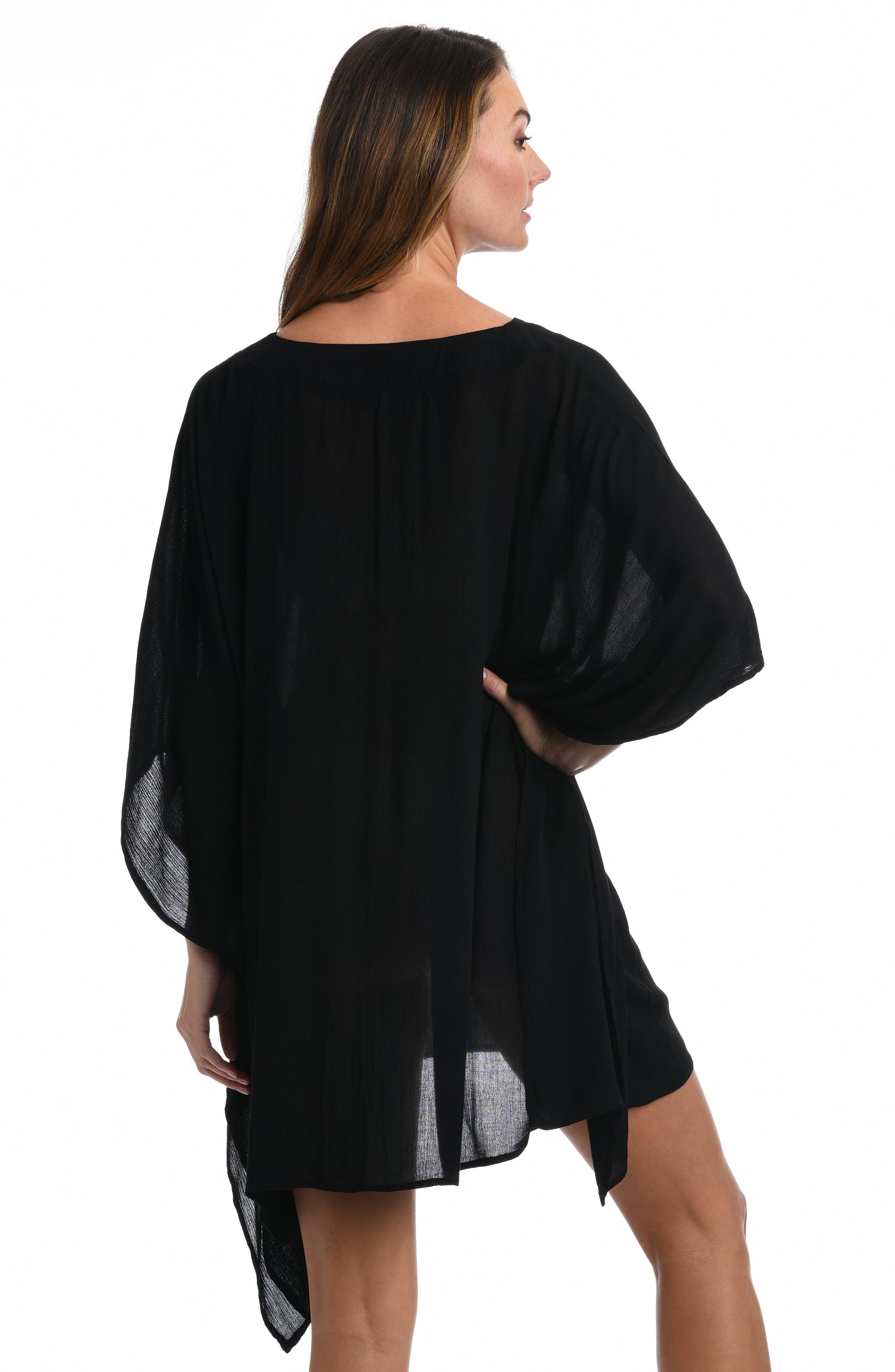 Model is wearing a black colored lace front caftan cover up fom our Apulia Mix collection.
