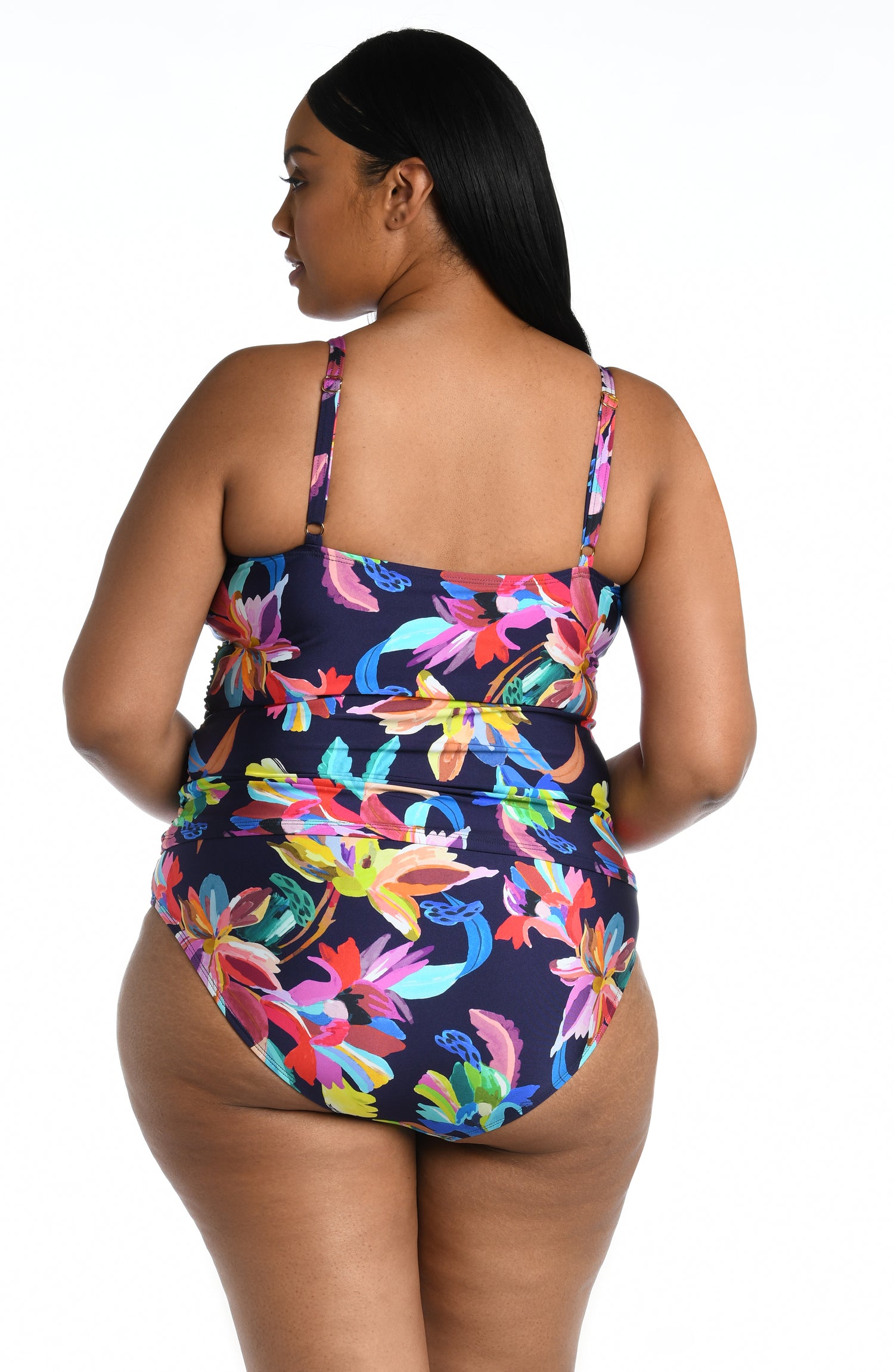 Model is wearing a multi-colored tropical printed tankini swimsuit top from our By the Sea collection.
