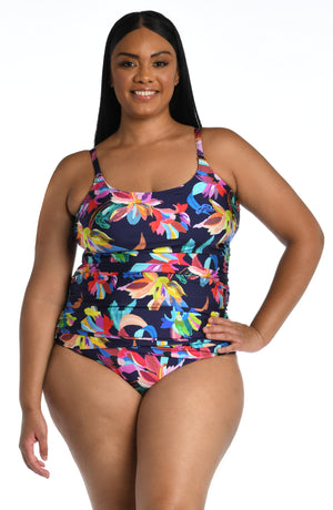 Model is wearing a multi-colored tropical printed tankini swimsuit top from our By the Sea collection.