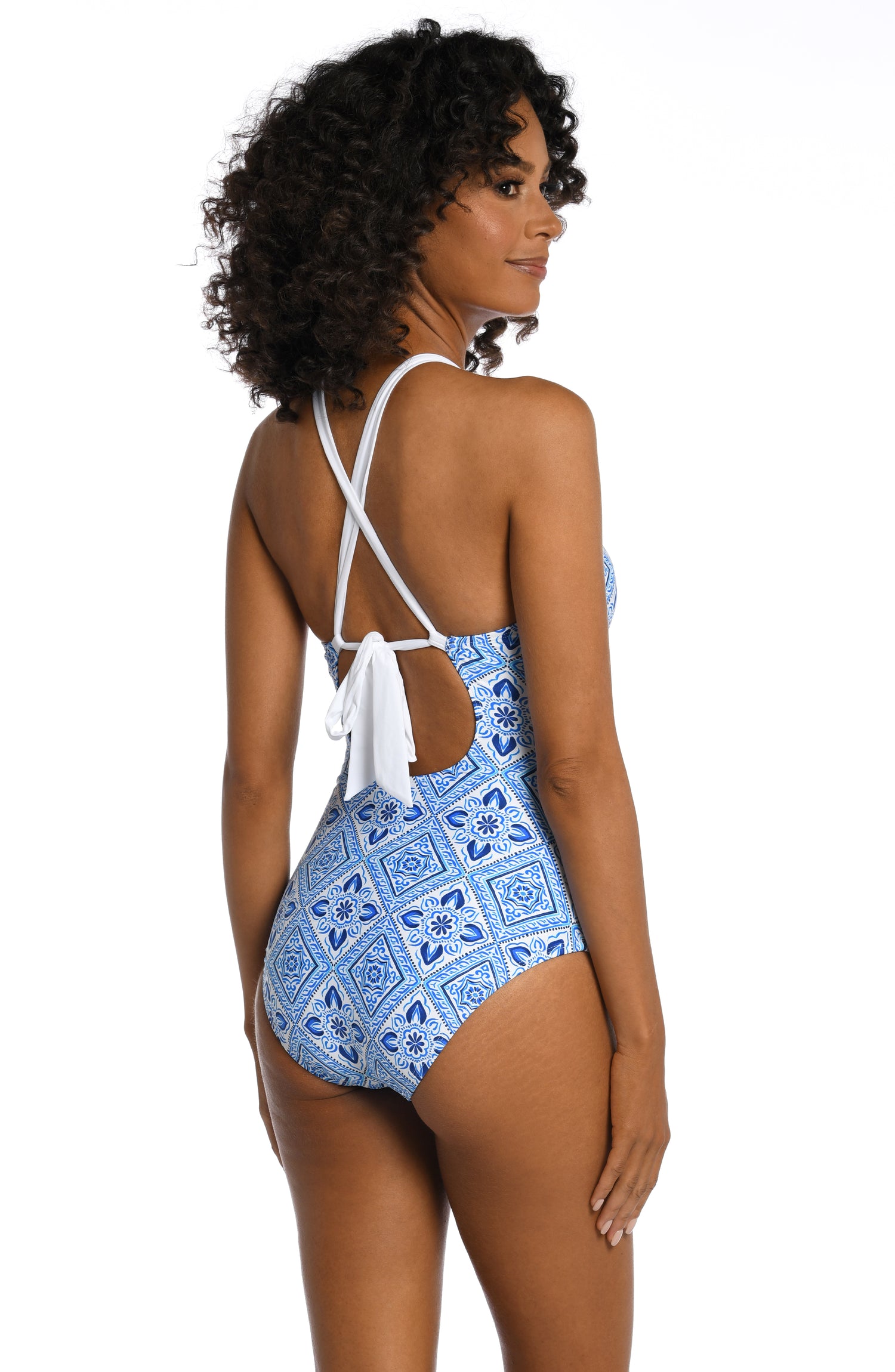 Model is wearing a light blue artful mosaic printed one piece swimsuit from our Mediterranean Breeze collection.