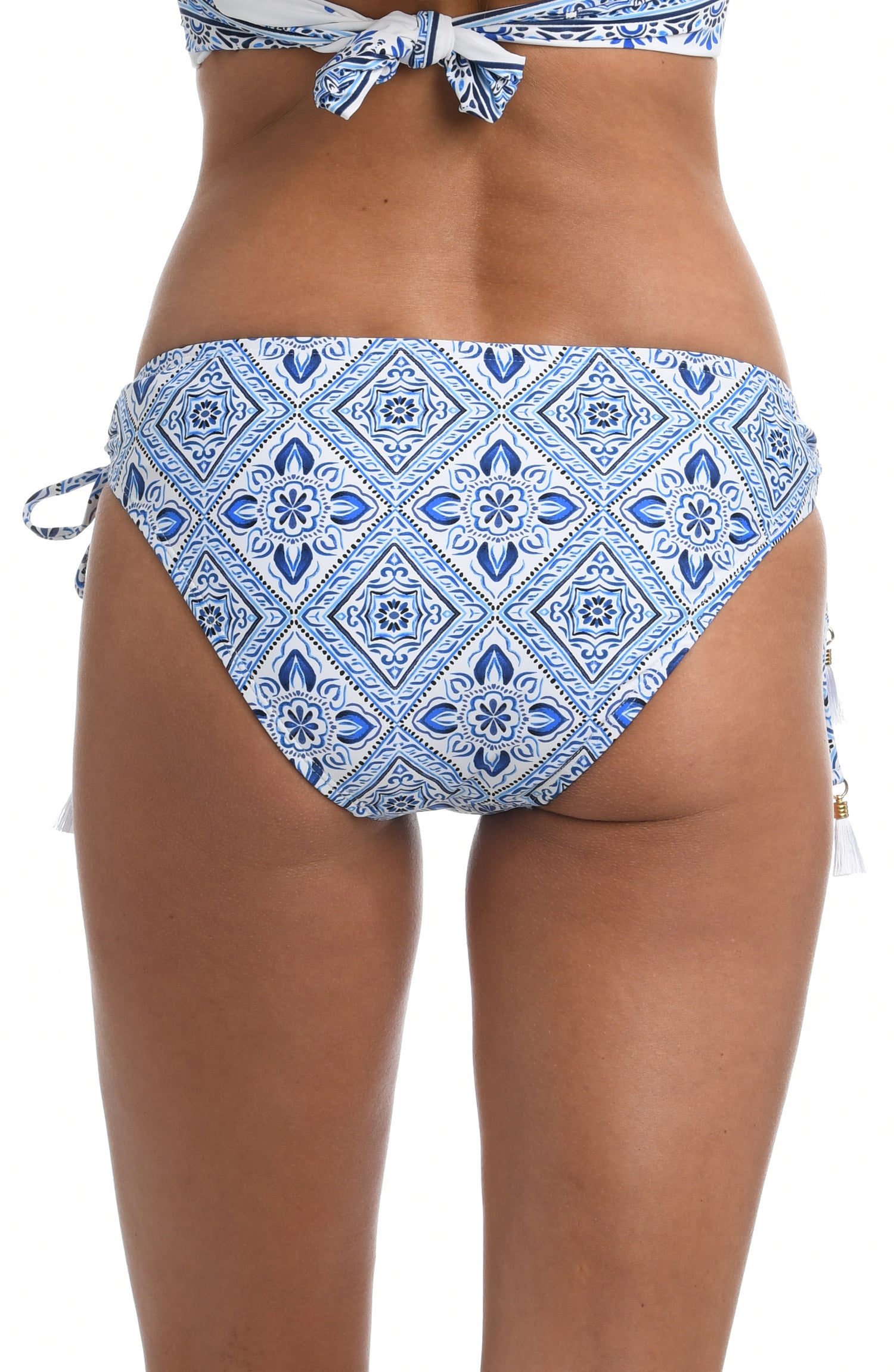 Model is wearing a light blue artful mosaic printed side-tie hipster swimsuit bottom from our Mediterranean Breeze collection.