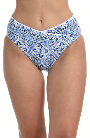 
            
                Load image into Gallery viewer, Model is wearing a light blue artful mosaic printed high waist swimsuit bottom from our Mediterranean Breeze collection.
            
        