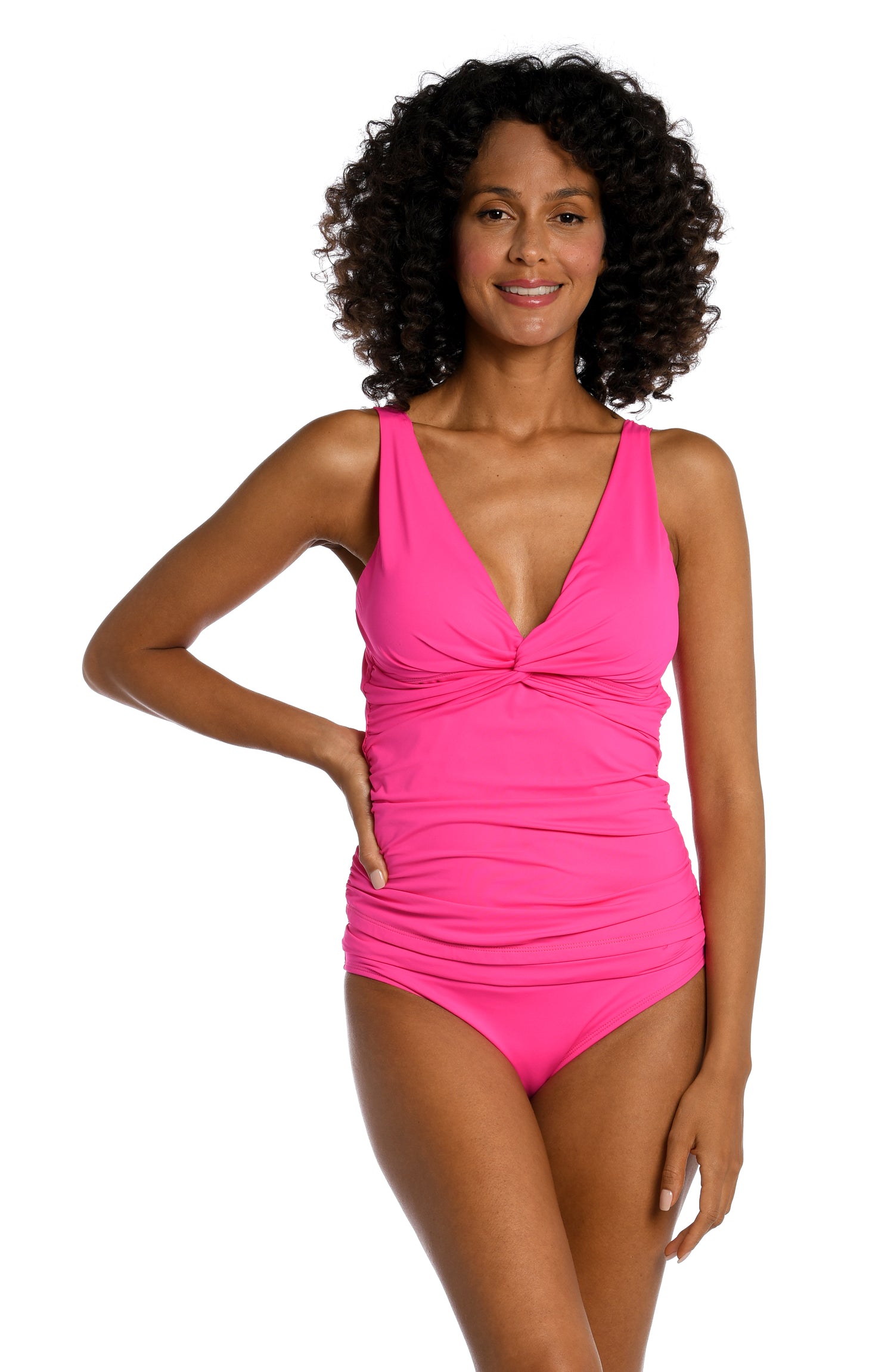 Model is wearing a pop pink colored tankini swimsuit top from our Best-Selling Island Goddess collection.