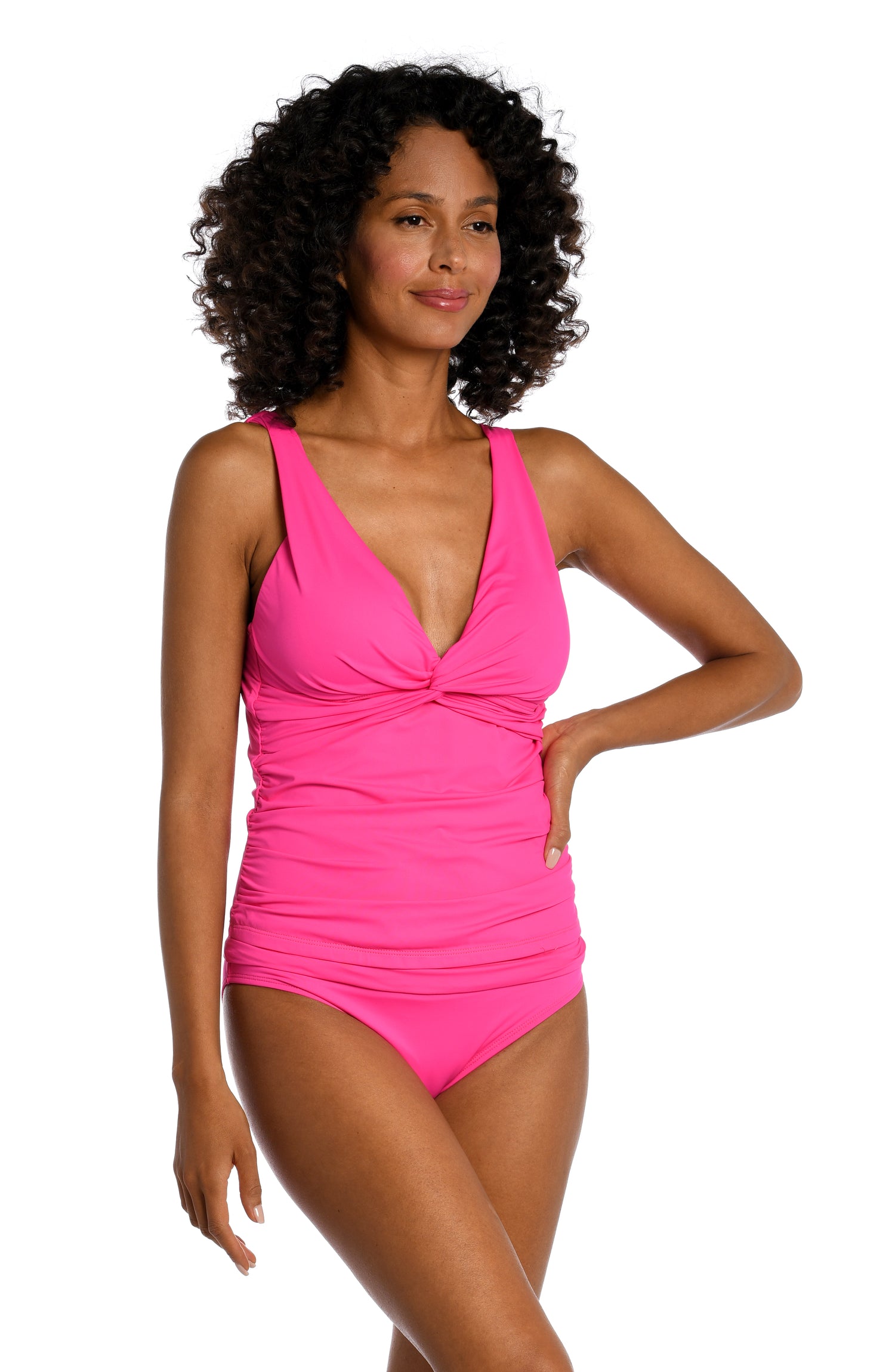 Model is wearing a pop pink colored tankini swimsuit top from our Best-Selling Island Goddess collection.