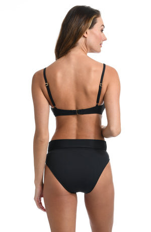 Model is wearing a black over the shoulder swimsuit top from our Best-Selling Island Goddess collection.