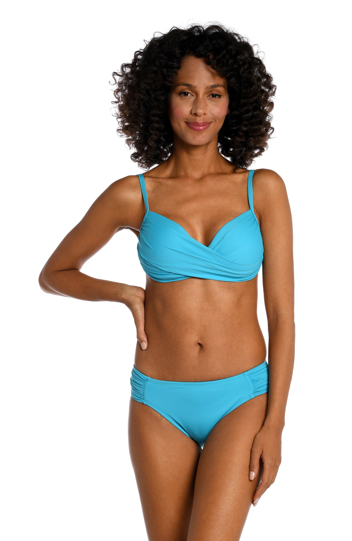 Model is wearing a azul (light blue) colored over the shoulder swimsuit top from our Best-Selling Island Goddess collection.