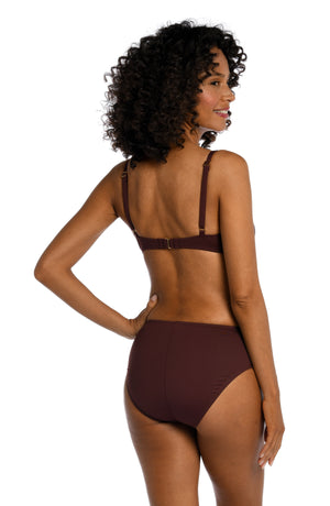 Model is wearing a java colored over the shoulder swimsuit top from our Best-Selling Island Goddess collection.