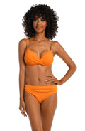 Model is wearing a tangerine colored over the shoulder swimsuit top from our Best-Selling Island Goddess collection.
