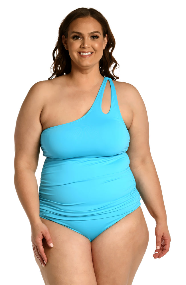 
            
                Load image into Gallery viewer, Model is wearing a azul (light blue) colored keyhole tankini swimsuit top from our Best-Selling Island Goddess collection.
            
        