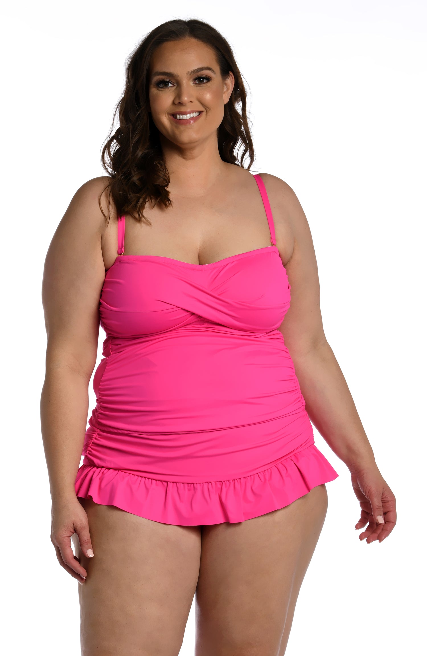 Model is wearing a pop pink colored bandeau tankini swimsuit top from our Best-Selling Island Goddess collection.