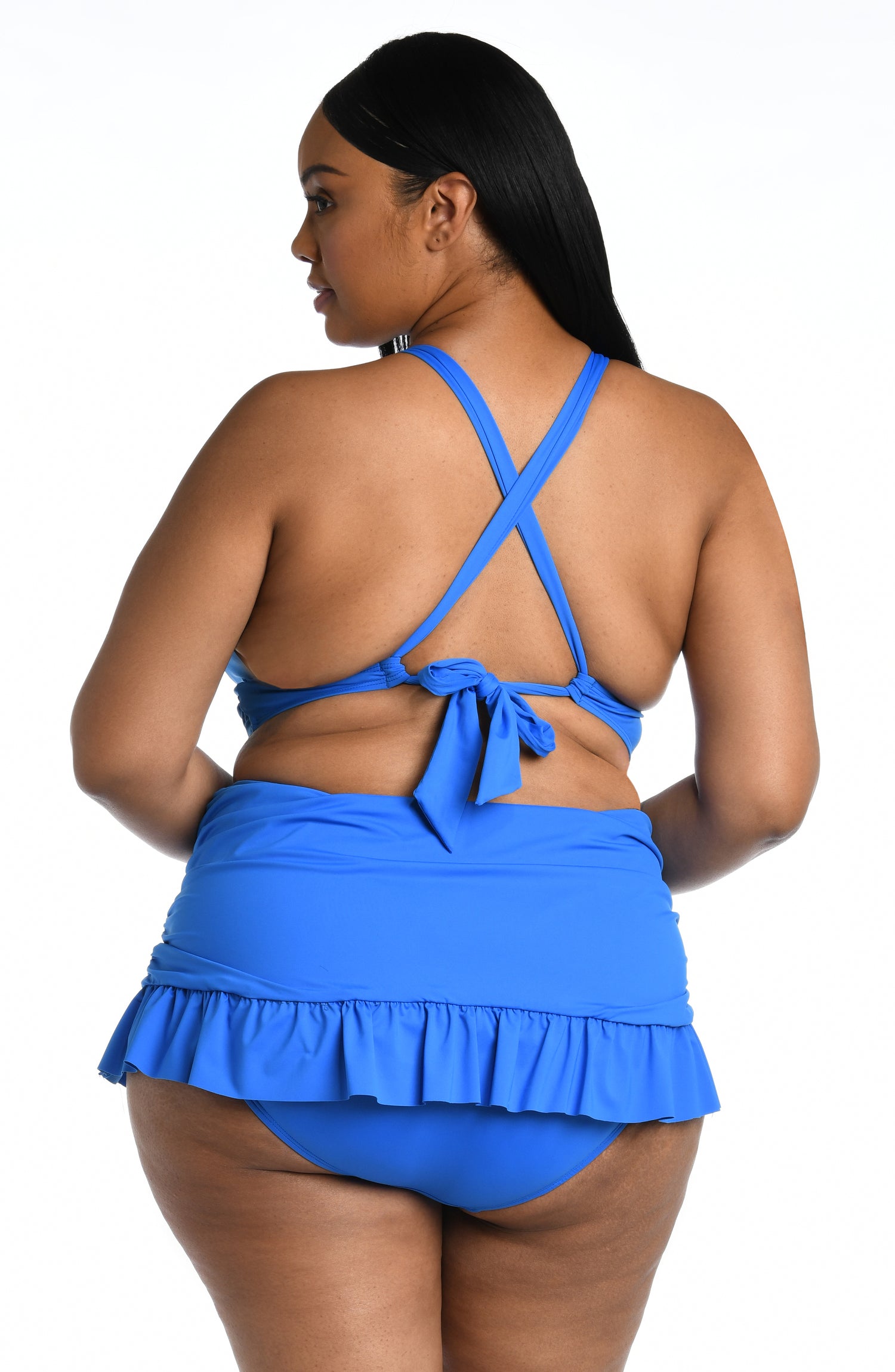 Model is wearing a capri blue colored midkini swimsuit top from our Best-Selling Island Goddess collection.