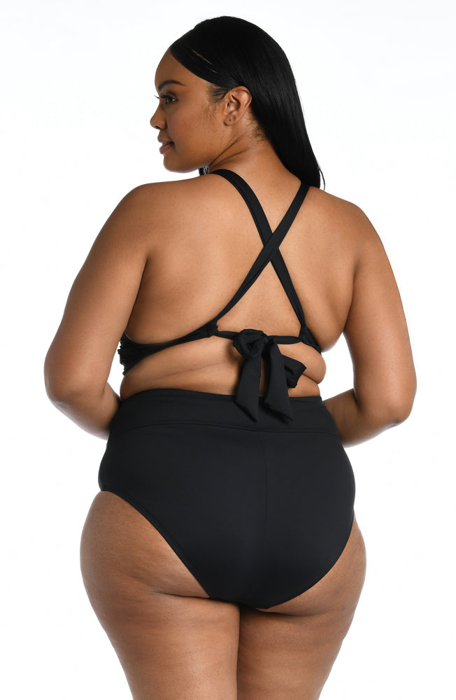 Model is wearing a black midkini swimsuit top from our Best-Selling Island Goddess collection.