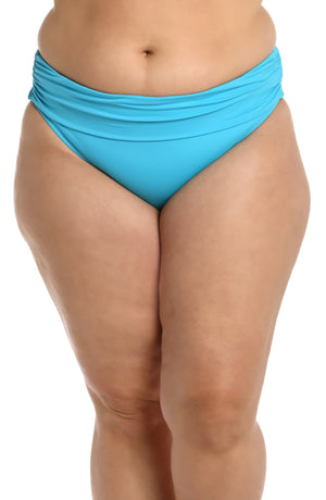 
            
                Load image into Gallery viewer, Model is wearing a azul (light blue) colored shirred hipster swimsuit bottom from our Best-Selling Island Goddess collection.
            
        