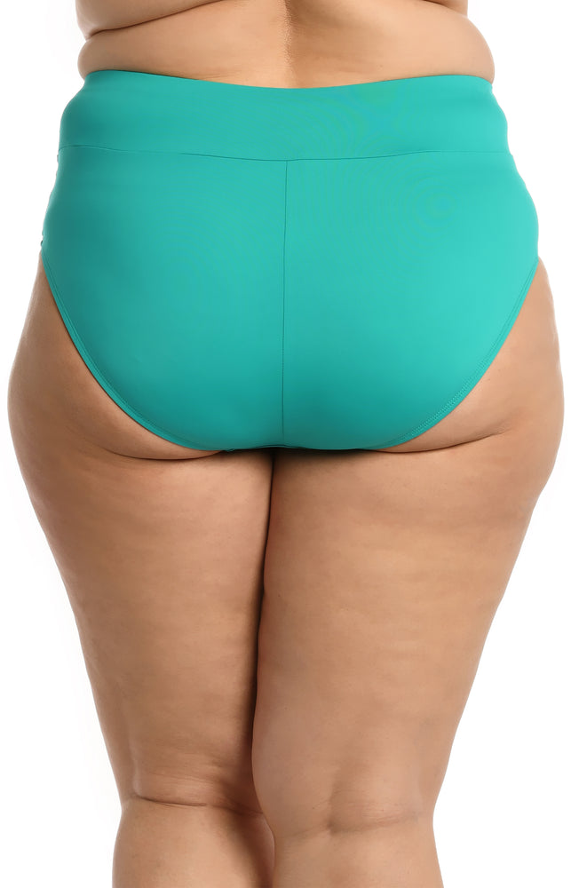 
            
                Load image into Gallery viewer, Model is wearing a emerald colored high waist swimsuit bottom from our Best-Selling Island Goddess collection.
            
        