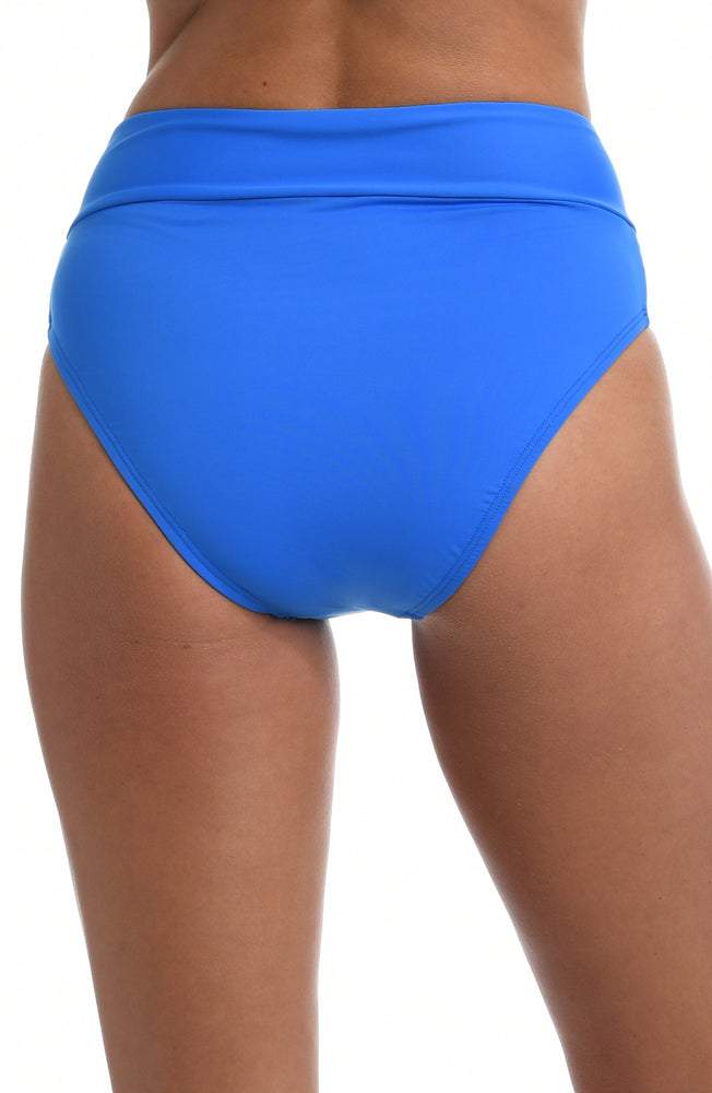 
            
                Load image into Gallery viewer, Model is wearing a capri blue colored high waist swimsuit bottom from our Best-Selling Island Goddess collection.
            
        