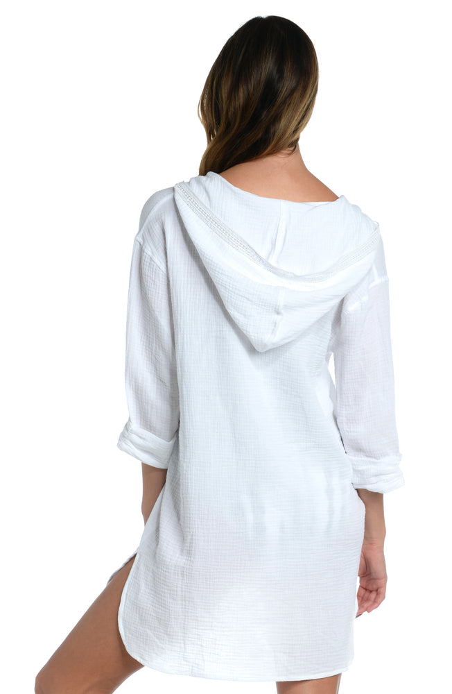 Model is wearing a white hooded cover up from our Seaside Covers collection!