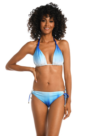 Model is wearing a sapphire colored ombre printed halter top from our Ocean Oasis collection!