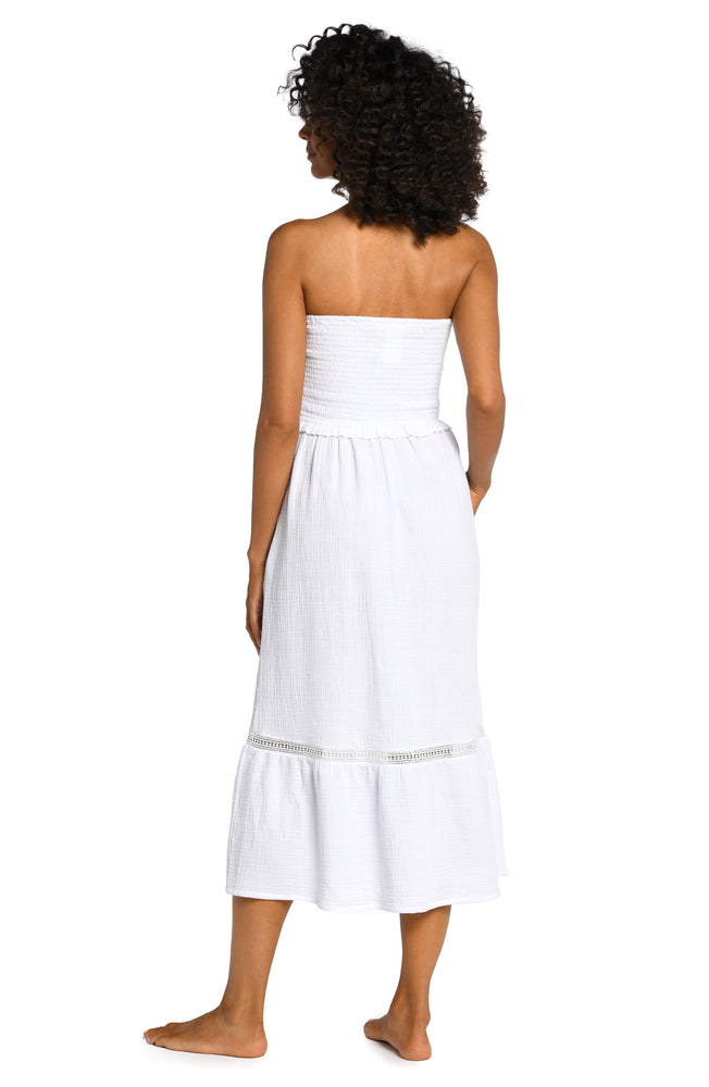 Model is wearing a white midi dress cover up from our Seaside Covers collection!